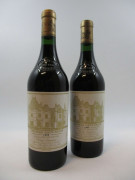 2 bouteilles CHÂTEAU HAUT BRION 1995 1er GC Pessac Léognan (étiquettes léger tachées)