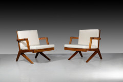 Olavi HÄNNINEN 1920-1992 Paire de fauteuils dits « Boomerang » - Circa 1950 Structure en chêne, accoudoirs gainés de cuir cognac, co...