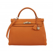 HERMÈS 2007  Sac KELLY Retourné 32 Veau Togo orange Garniture métal argenté palladié Bandoulière  KELLY Retourné 32...