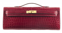 HERMÈS 2017  Pochette KELLY CUT Crocodile d'estuaire lisse Braise (Crocodylus porosus) II/B Garniture métal plaqué or R...