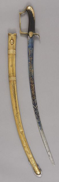 Sabre d'enfant type d'Officier de Cavalerie légère. Poignée en ébène quadrillée. Monture en laiton gravé. Calotte à courte queue. Ga...