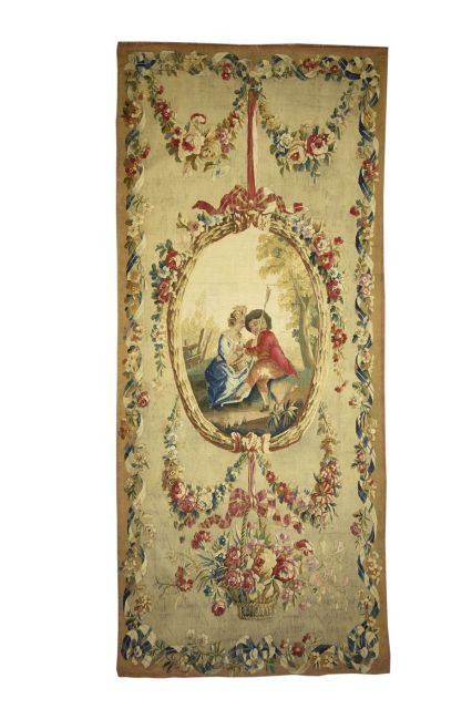 SUITE DE SEPT TAPISSERIES DE BEAUVAIS D'EPOQUE LOUIS XVI En laine, chaque panneau de forme rectangulaire sur fond crème orné au centre