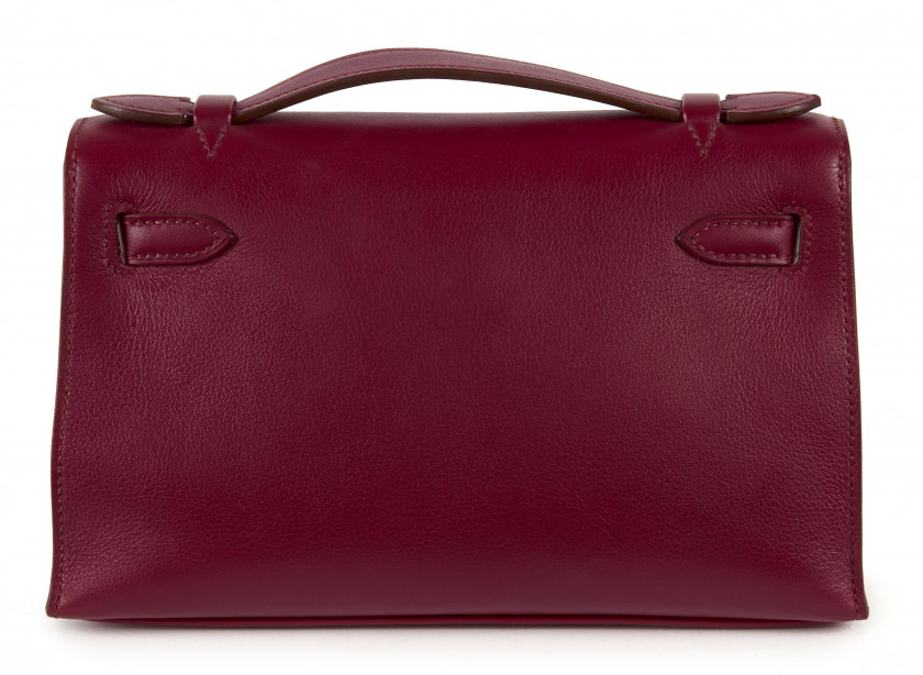 HERMÈS 2010  Pochette KELLY Veau Swift Rubis Garniture métal argenté palladié  KELLY clutch Rubis Swift calfskin lea...