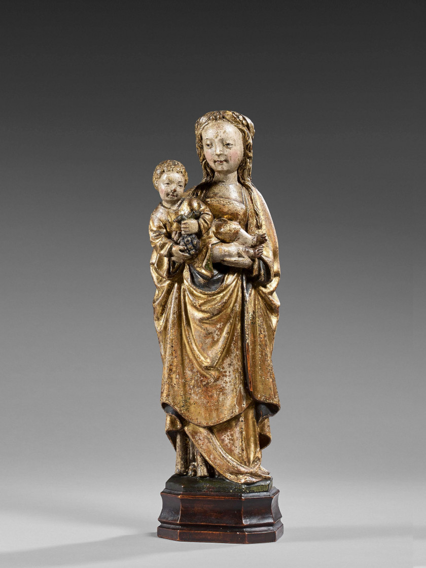 Pays-Bas méridionaux, Malines, début du XVIe siècle  La Vierge à l'Enfant tenant une grappe de raisins Statuette d'applique en noyer.