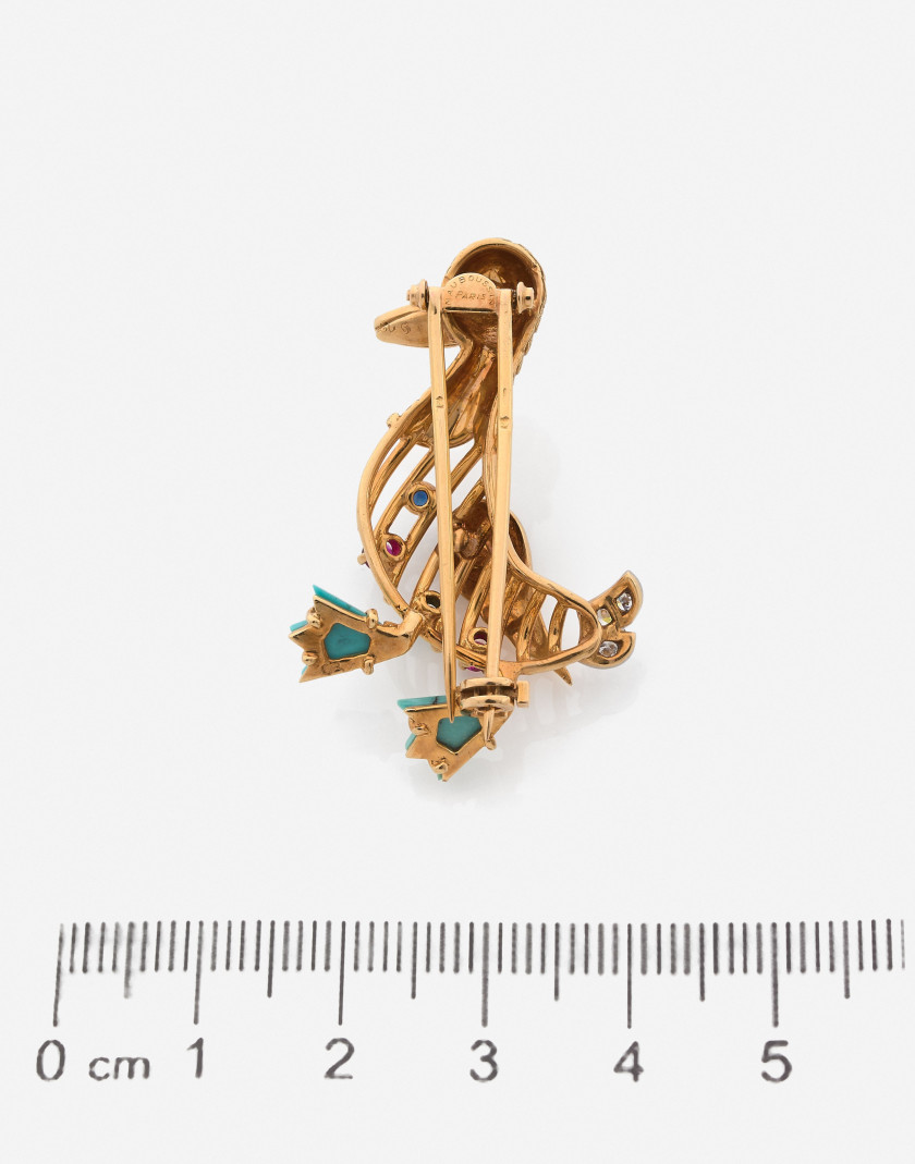 MAUBOUSSIN Clip or, platine, diamants, turquoise, rubis, saphir émeraude A diamond, sapphire, ruby, emerald, turquoise, gold and plati