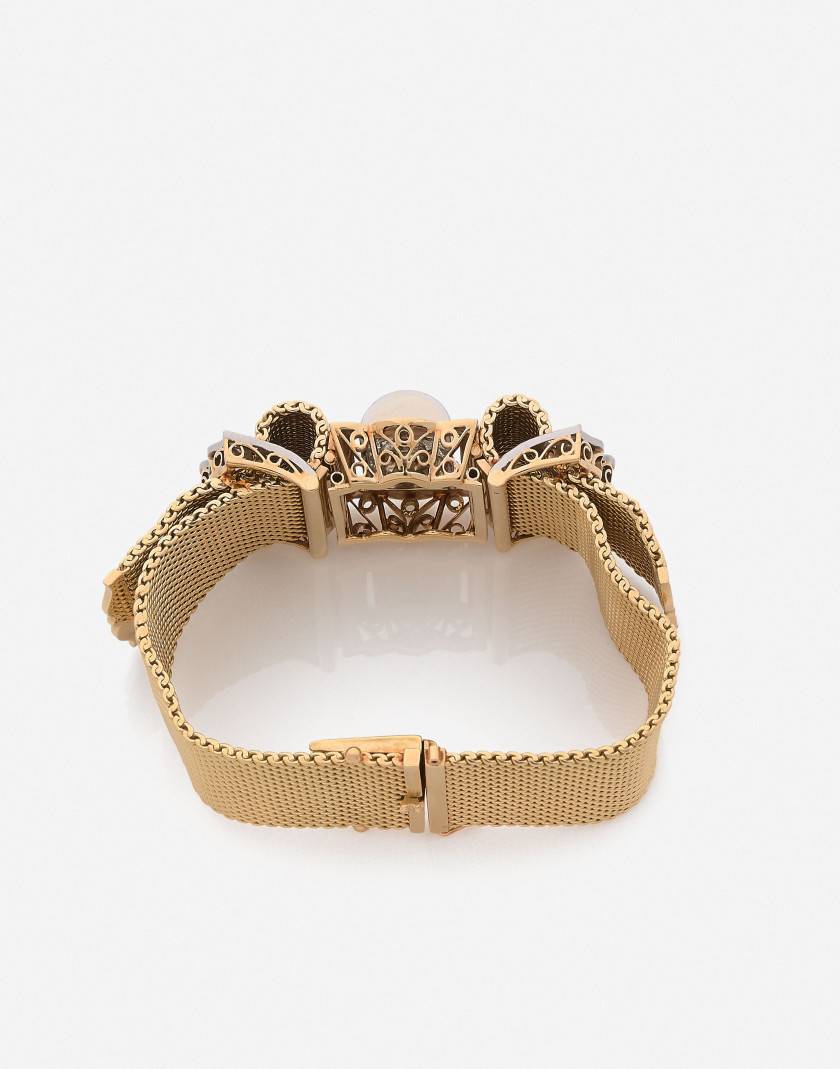 Bracelet ceinture Or, platine et diamants, vers 1950 A diamond, gold and platinum bracelet, circa 1950