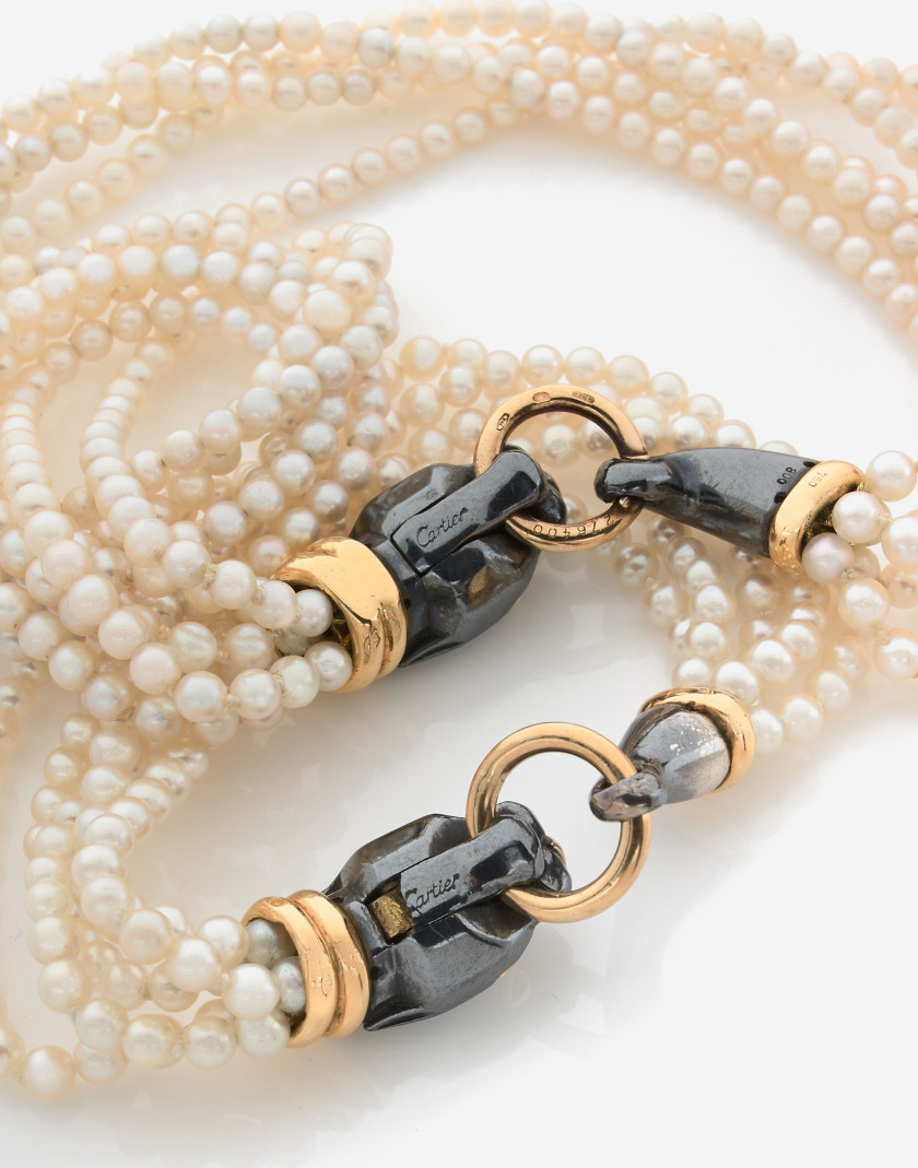 CARTIER  Collier et bracelet en or, argent et perles de culture A cultured pearl, gold and silver set (necklace and bracelet)