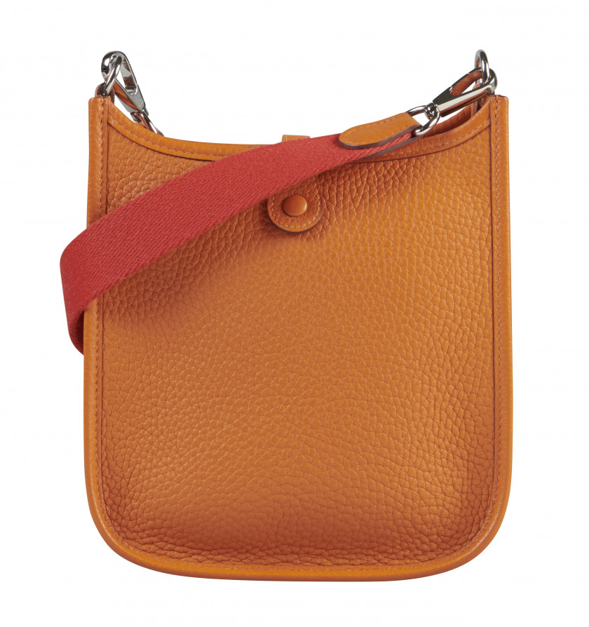 HERMÈS 2016  Sac Mini ÉVELYNE Taurillon Clémence orange Garniture métal argenté palladié Dimensions : 16,5 x 18 x 5,5 cm...